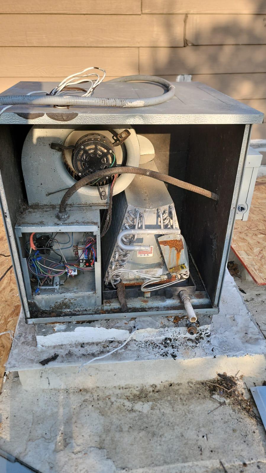 Expert HVAC technician performing maintenance on an air conditioning unit in Conroe TX